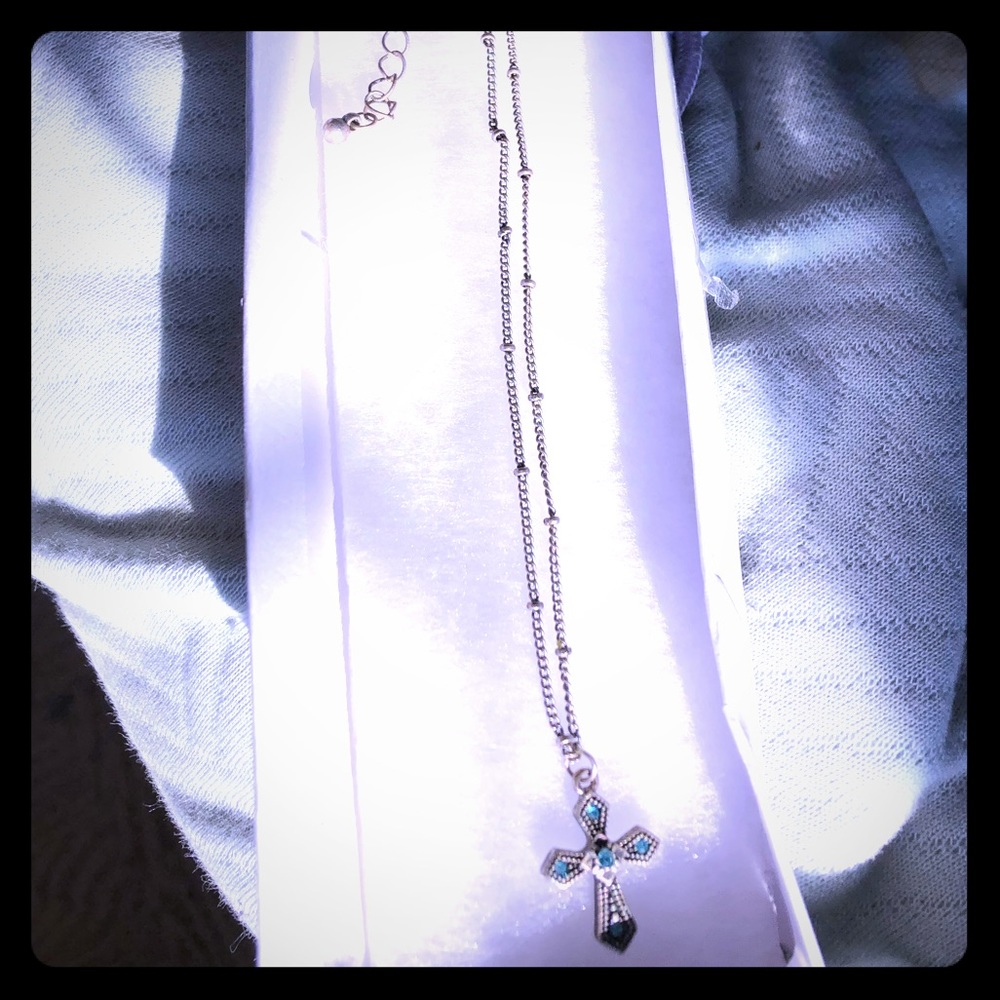 Small cross necklace with blue gems